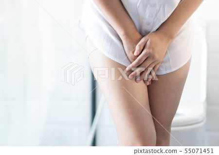 Close up woman stomachache with toilet in the 55071451