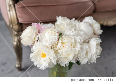 White peonies in a metal vase. Beautiful peony flower for catalog or online store. Floral shop 55074114