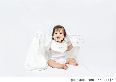 Little baby girl playing with a white bath towel on a white background. Happy, affection, baby, childcare image Little baby girl playing with a white bath towel on a white background. Happy, affection, baby, childcare image 55074517
