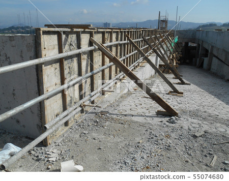 Workers installing & fabricating timber form work Workers installing & fabricating timber form work 55074680