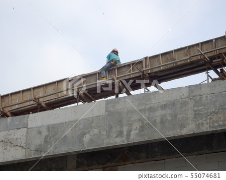 Workers installing & fabricating timber form work Workers installing & fabricating timber form work 55074681