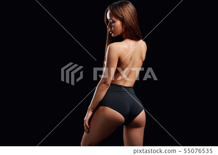 sexual girl showing streptease , isolated black background sexual girl showing streptease , isolated black background 55076535