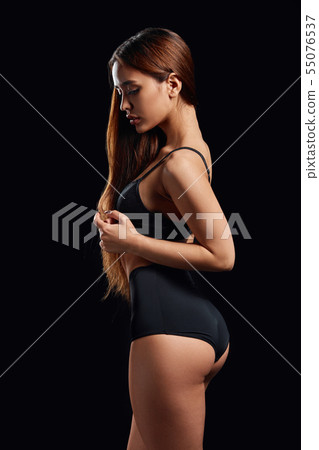 sexy woman demonstrating black swimsuit sexy woman demonstrating black swimsuit 55076537