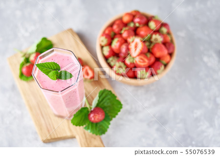 Strawberry smoothie and fresh strawberries Strawberry smoothie and fresh strawberries 55076539
