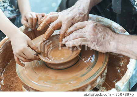Handcrafted, Hands make clay. Master teaches the 55078970