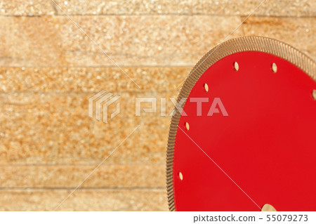A fragment of a red diamond blade for cutting 55079273