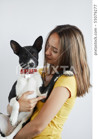 kind friendly girl takes care of her dog 55079277