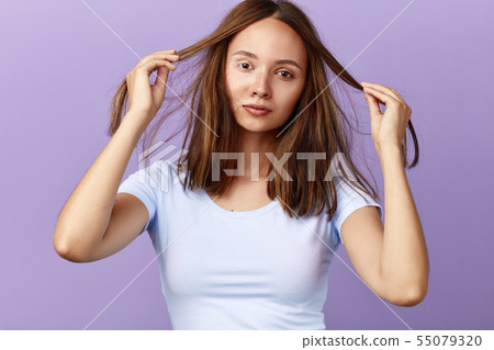 nice attractive girl touching her hair, has - Stock Photo [55079320] -  PIXTA