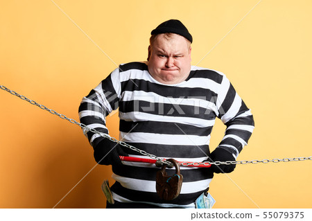 nervous prisoner making effort to cut the chain nervous prisoner making effort to cut the chain 55079375