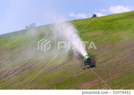 Snow making machines used to water grass on slope, Snow making machines used to water grass on slope, 55079481