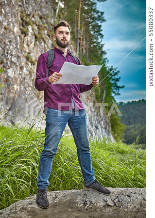 Young man travels in the wild. Young man travels in the wild. 55080337