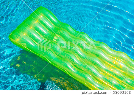 Colorful swim ring or rubber float around swimming pool water Colorful swim ring or rubber float around swimming pool water 55093168