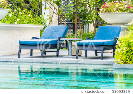 Beautiful outdoor swimming pool in hotel and resort with chair and deck for leisure vacation Beautiful outdoor swimming pool in hotel and resort with chair and deck for leisure vacation 55093529