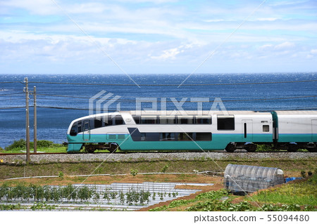 Express train running along the sea 55094480
