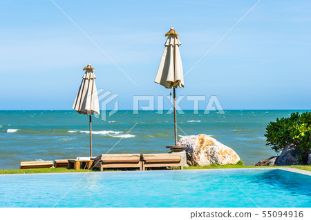 Beautiful outdoor nature landscape with bed deck chair around swimming pool in hotel resort 55094916