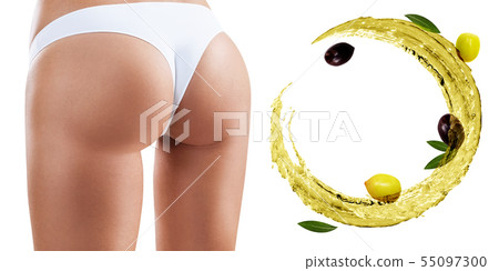 Female buttocks near swirl olive oil. Dieting concept. Female buttocks near swirl olive oil. Dieting concept. 55097300