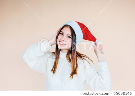 Beautiful smiling girl with clean skin in santa 55098146