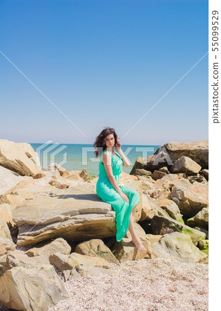 Young girl on summer beach with shell Young girl on summer beach with shell 55099529