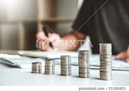 Man using calculator Accounting Calculating Cost Man using calculator Accounting Calculating Cost 55100951