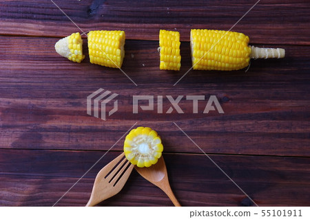 pieces of corn instant cooking with wooden spoon . 55101911
