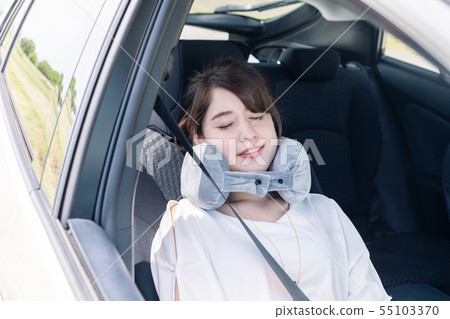 Woman sleeping in car 55103370