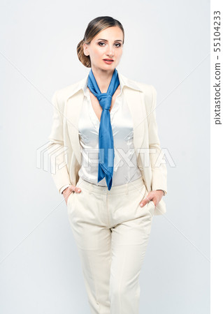 Fashionable businesswoman wearing white suit and blue scarf 55104233