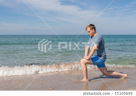 Handsome Man Exercising At Beach, Training Outdoor Handsome Man Exercising At Beach, Training Outdoor 55105695