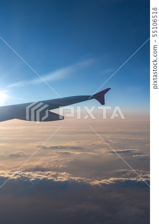 view of aircraft wing silhouette and dark blue sky 55106518