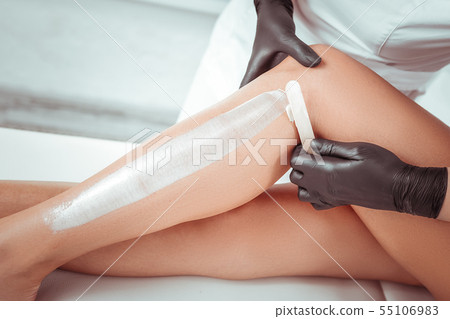 Professional depilation master using special techniques and wooden tool Professional depilation master using special techniques and wooden tool 55106983
