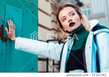 Blue-eyed young model posing while promoting winter clothes 55107262