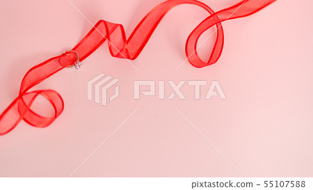 Ring and red ribbon 55107588