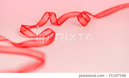 Ring and red ribbon 55107590