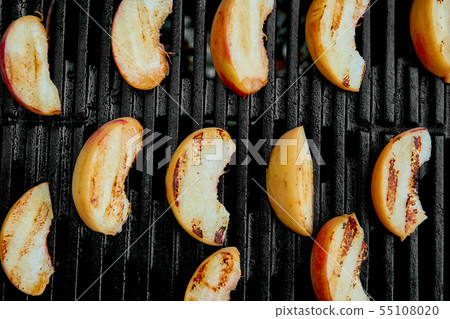 Grilled peach on black gas grill. Grilled dessert. Grilled peach on black gas grill. Grilled dessert. 55108020