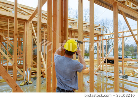 Construction crew working on the roof sheeting of Construction crew working on the roof sheeting of 55108210