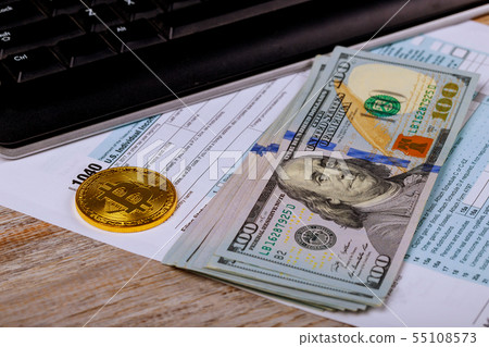 Tax papers in an envelope with 100 dollar bills 55108573