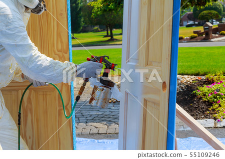 Master painting wood doors with spray gun Master painting wood doors with spray gun 55109246