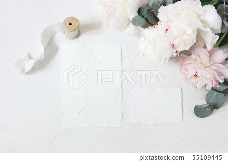 Feminine wedding, birthday table composition with floral bouquet. White and pink peonies flowers 55109445