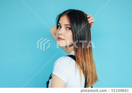 Beautiful girl with dark long hair in white 55109681