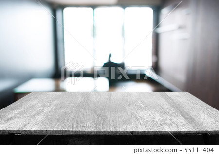 empty wood table in front of blur coffee shop / empty wood table in front of blur coffee shop / 55111404
