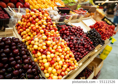 A lot of cherries in box on sale at farms market 55111526