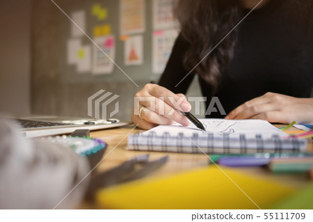 Fashion designer stylish drawing at a studio Fashion designer stylish drawing at a studio 55111709