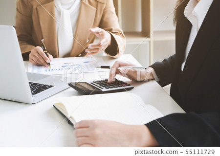 business financier audit working with laptop and business financier audit working with laptop and 55111729