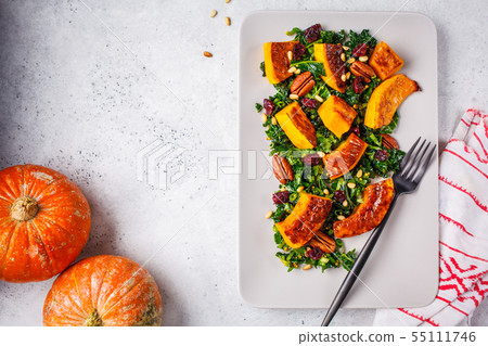 Pumpkin salad with nuts, cranberries and kale  55111746