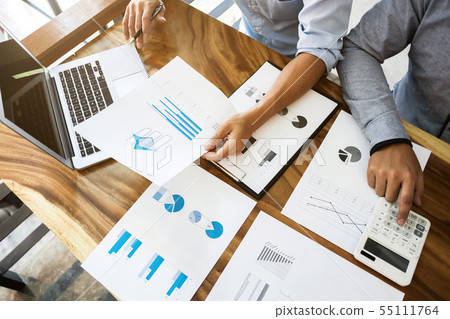 two businessman working together with financial two businessman working together with financial 55111764