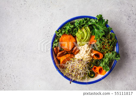 Healthy vegan lunch in white bowl. Buddha bowl Healthy vegan lunch in white bowl. Buddha bowl 55111817