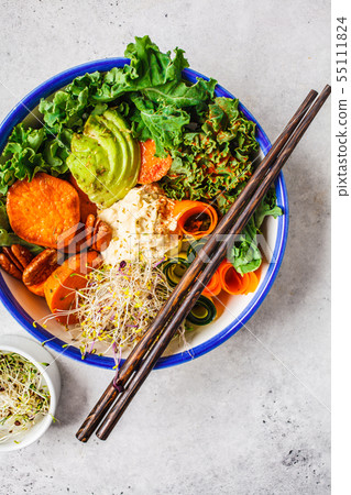 Healthy vegan lunch in white bowl. Buddha bowl Healthy vegan lunch in white bowl. Buddha bowl 55111824