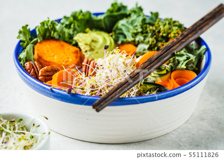 Healthy vegan lunch in white bowl. Buddha bowl Healthy vegan lunch in white bowl. Buddha bowl 55111826