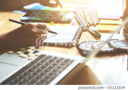 young creative atelier fashion designer working on 55111834