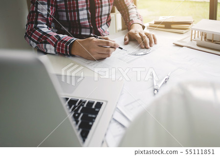 engineer architect working on blueprint with tools 55111851