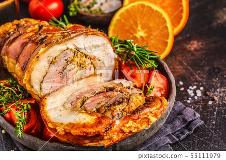 Classic baked pork porchetta with oranges. Classic baked pork porchetta with oranges. 55111979